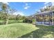 Backyard oasis with screened pool and pond view at 19617 Sunset Bay Dr, Land O Lakes, FL 34638