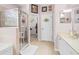 Bathroom with a walk-in shower, double vanity, and large closet at 19617 Sunset Bay Dr, Land O Lakes, FL 34638