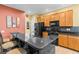 Modern kitchen with granite countertop and black appliances at 19617 Sunset Bay Dr, Land O Lakes, FL 34638