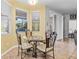 Breakfast nook with glass-top table and ornate chairs at 19617 Sunset Bay Dr, Land O Lakes, FL 34638