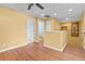 Upstairs hallway with wood flooring and ceiling fan at 19617 Sunset Bay Dr, Land O Lakes, FL 34638