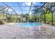 Enjoy this refreshing pool with a water feature and screened enclosure at 19617 Sunset Bay Dr, Land O Lakes, FL 34638