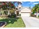 Two-story house with a yard and driveway at 19617 Sunset Bay Dr, Land O Lakes, FL 34638