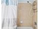 Clean shower with tiled walls and curtain at 19617 Sunset Bay Dr, Land O Lakes, FL 34638