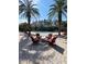 Resort-style pool with lounge chairs and palm trees at 19617 Sunset Bay Dr, Land O Lakes, FL 34638