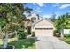 Beautiful two-story house with landscaping, driveway, and attached garage at 19617 Sunset Bay Dr, Land O Lakes, FL 34638