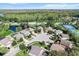 Neighborhood view with houses and tennis courts at 19617 Sunset Bay Dr, Land O Lakes, FL 34638