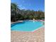 Inviting community pool with plenty of deck space at 19617 Sunset Bay Dr, Land O Lakes, FL 34638
