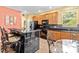 Kitchen features a breakfast nook and granite countertops at 19617 Sunset Bay Dr, Land O Lakes, FL 34638