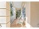 Inviting front porch with white chairs and a view of the yard at 19617 Sunset Bay Dr, Land O Lakes, FL 34638