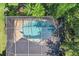 Bird's-eye view of a screened-in pool and patio area at 19617 Sunset Bay Dr, Land O Lakes, FL 34638