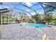 Large screened in pool and patio perfect for entertaining at 19617 Sunset Bay Dr, Land O Lakes, FL 34638