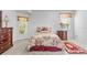 Bedroom with a double bed, window, and dresser at 19617 Sunset Bay Dr, Land O Lakes, FL 34638