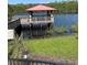 Wooden dock and gazebo over a lake at 19617 Sunset Bay Dr, Land O Lakes, FL 34638