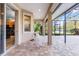 Relaxing covered patio overlooking the pool and backyard at 19617 Sunset Bay Dr, Land O Lakes, FL 34638