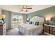 Main bedroom with water views and a floral headboard at 8213 County Line Rd, Spring Hill, FL 34606
