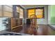 Cozy dining area with wood flooring and a wood table at 1432 S Keene Rd, Clearwater, FL 33756