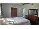 Bedroom with double bed, dresser and closet at 1432 S Keene Rd, Clearwater, FL 33756