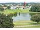 Aerial view of house and golf course at 13744 Carryback Dr, Dade City, FL 33525