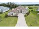 Luxury home with tile roof, stone accents and a large lot at 13744 Carryback Dr, Dade City, FL 33525