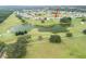 House nestled on golf course near lake at 13744 Carryback Dr, Dade City, FL 33525