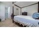 Elegant bedroom with canopy bed, dresser, and ensuite bathroom access at 13744 Carryback Dr, Dade City, FL 33525