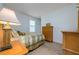 Charming bedroom with wood dresser and window with plantation shutters at 13744 Carryback Dr, Dade City, FL 33525