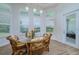 Breakfast nook with glass table and wicker chairs at 13744 Carryback Dr, Dade City, FL 33525