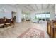 Open concept dining room with hardwood floors and large windows at 13744 Carryback Dr, Dade City, FL 33525