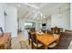 Bright dining room with hardwood floors and a chandelier at 13744 Carryback Dr, Dade City, FL 33525