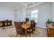 Formal dining area with wood table and wicker chairs at 13744 Carryback Dr, Dade City, FL 33525