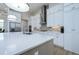 Sleek kitchen island with quartz countertop and stainless steel appliances at 13744 Carryback Dr, Dade City, FL 33525