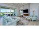 Living room with fireplace and access to outdoor patio at 13744 Carryback Dr, Dade City, FL 33525