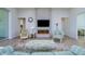 Bright living room with fireplace and access to backyard at 13744 Carryback Dr, Dade City, FL 33525