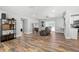 Open living room with wood-look floors and recessed lighting at 692 Oakwood Dr, Dunedin, FL 34698