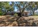 Large backyard with screened pool, mature trees and open space at 15123 Copeland Way, Spring Hill, FL 34604