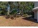 Spacious backyard with a screened pool and large trees at 15123 Copeland Way, Spring Hill, FL 34604