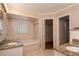 Elegant bathroom with granite countertops and a soaking tub at 15123 Copeland Way, Spring Hill, FL 34604