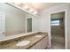Bathroom with double vanity, granite countertop and tiled floor at 15123 Copeland Way, Spring Hill, FL 34604