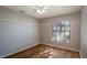 Spacious bedroom with ceiling fan and wood-look flooring at 15123 Copeland Way, Spring Hill, FL 34604