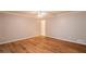 Simple bedroom with hardwood floors and an ensuite bathroom at 15123 Copeland Way, Spring Hill, FL 34604