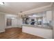 Bright dining area with wood-look flooring and kitchen views at 15123 Copeland Way, Spring Hill, FL 34604