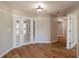 Bright entryway with wood-look flooring and french doors at 15123 Copeland Way, Spring Hill, FL 34604