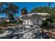 Two car garage with an attached carport at 15123 Copeland Way, Spring Hill, FL 34604