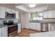 Updated kitchen with granite countertops at 15123 Copeland Way, Spring Hill, FL 34604