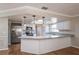 Updated kitchen boasts a large island with granite countertops and stainless steel appliances at 15123 Copeland Way, Spring Hill, FL 34604