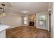 Living room features a stone fireplace and wood-look flooring at 15123 Copeland Way, Spring Hill, FL 34604