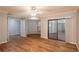 Open living room with hardwood floors and multiple access points at 15123 Copeland Way, Spring Hill, FL 34604