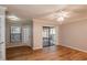 Spacious living area featuring hardwood floors and sliding glass doors at 15123 Copeland Way, Spring Hill, FL 34604