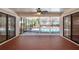 Spacious covered patio with sliding glass doors overlooking the pool at 15123 Copeland Way, Spring Hill, FL 34604
